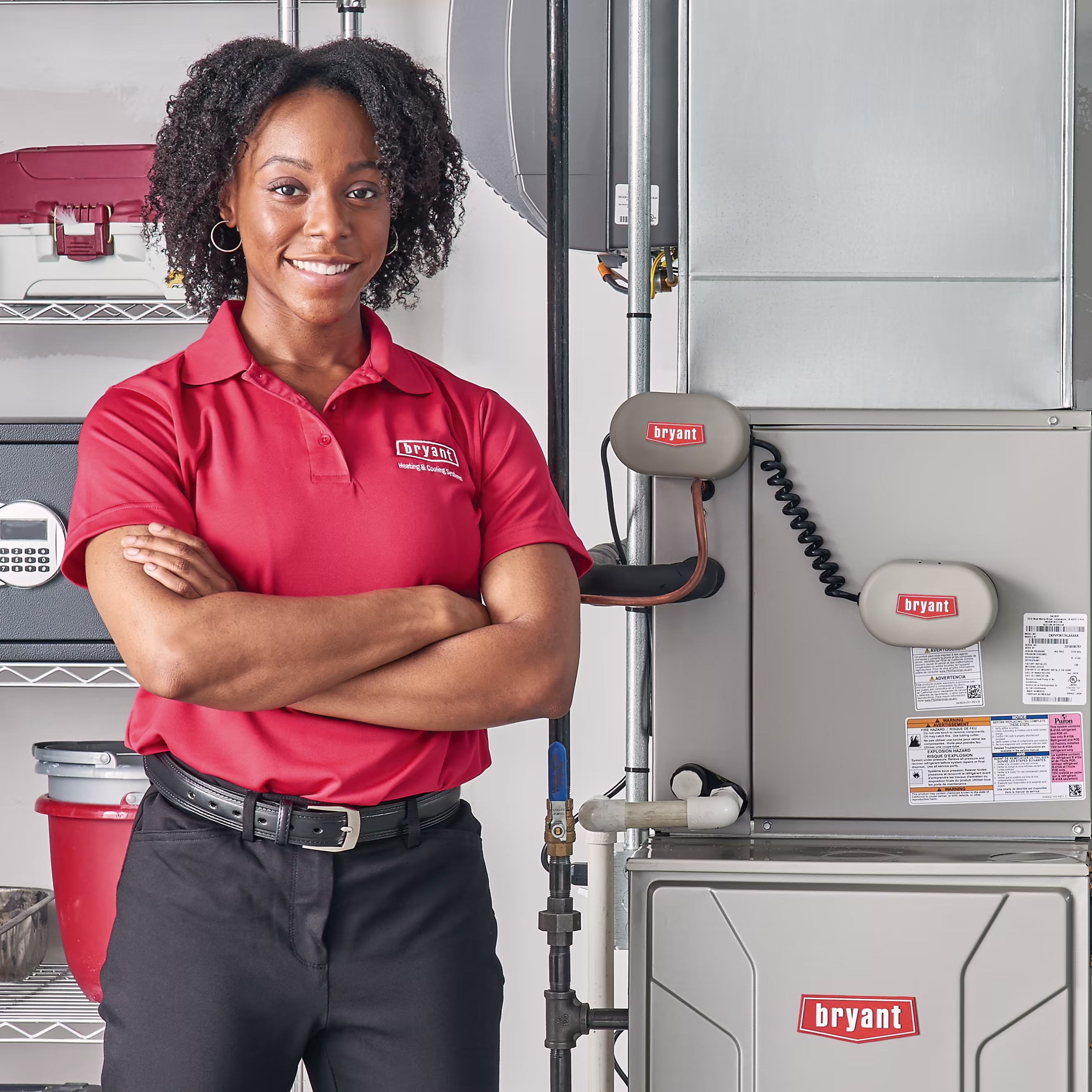 澳洲幸运10彩票官网 hvac contractor stands in front of a gas furnace